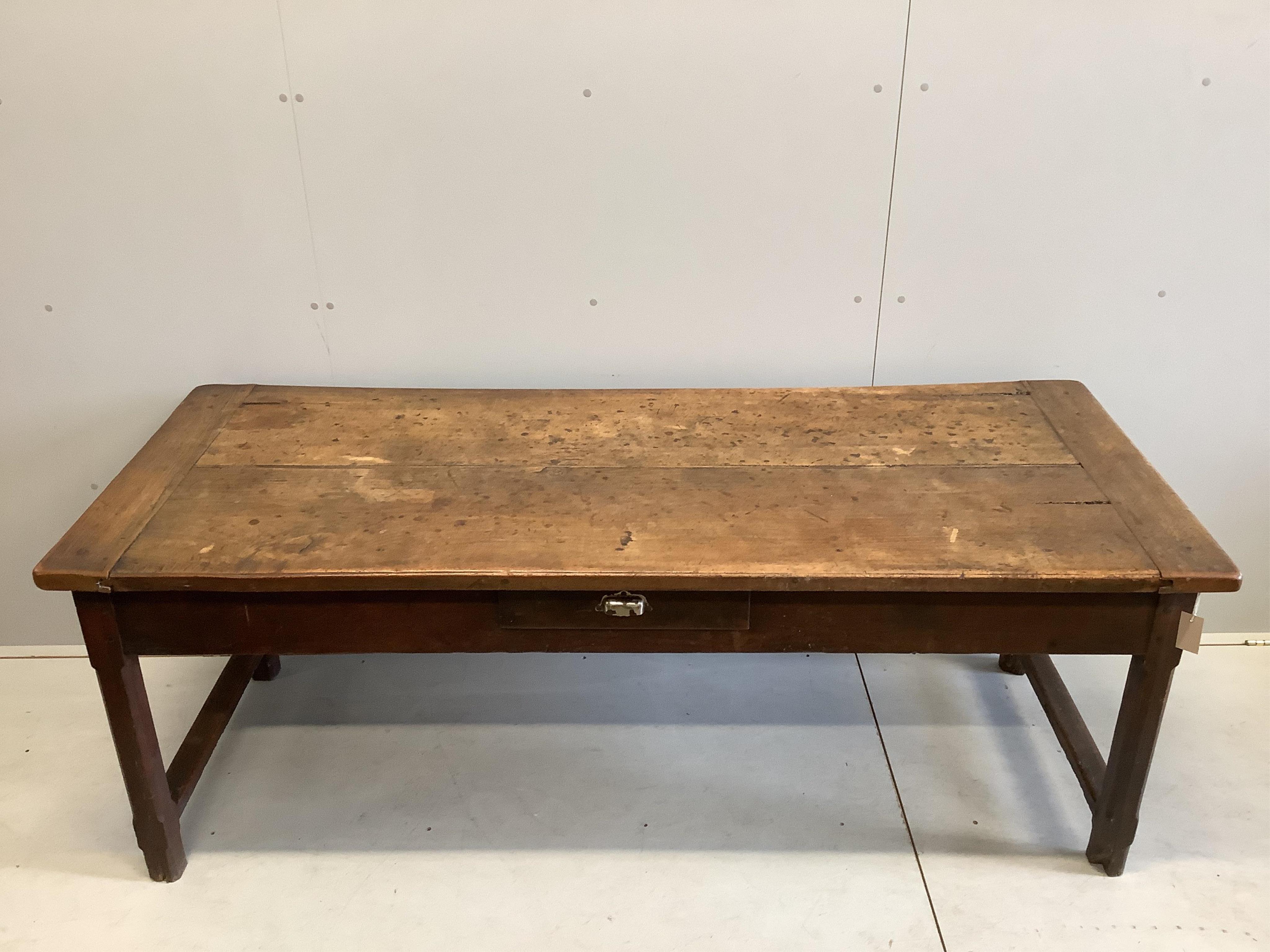 A 19th century French fruitwood three drawer kitchen table with cleated twin plank top, width 193cm, depth 79cm, height 72cm. Condition - fair